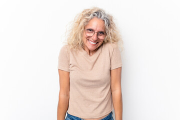 Middle age caucasian woman isolated on white background laughs and closes eyes, feels relaxed and happy.