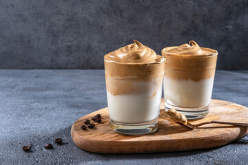 Dalgona coffee, Iced fluffy creamy whipped trend drink with coffee foam and milk.
