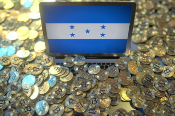 Computer with flag of Honduras and pile of bitcoins. National regulations and cryptocurrency mining conceptual 3d rendering