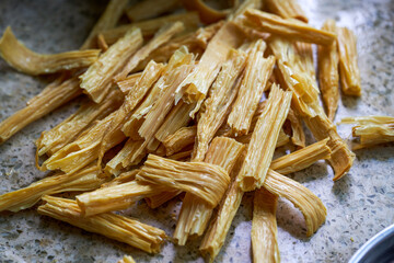 A pile of fresh yuba in the kitchen close-up