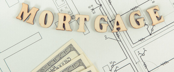 Inscription mortgage and dollar on electrical drawing, buying or building house concept