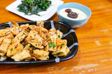 Simple vegetarian dish with eggs, tofu and sauteed vegetables.