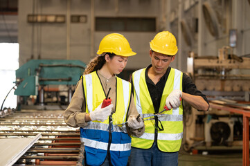 Team Asian engineer working control machine in factory. Group people Asia Worker control machine with manufacturing of industry.