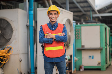 Confident Asian engineer standing in  factory , Asia worker employee in hard hat safety work in...