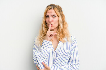 Young caucasian woman isolated on white background keeping a secret or asking for silence.