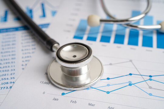 Stethoscope on chart and graph paper, Finance, Account, Statistics, Investment, Analytic research data economy and Business company concept.
