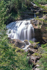 Obraz premium beautiful waterfall in the middle of the mountain