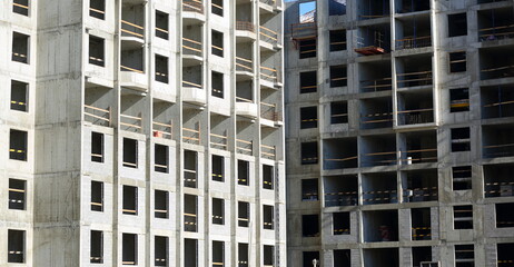 Fototapeta premium Facade of a new modern apartment building under construction, Oktyabrskaya Embankment, St. Petersburg, Russia, August 2022