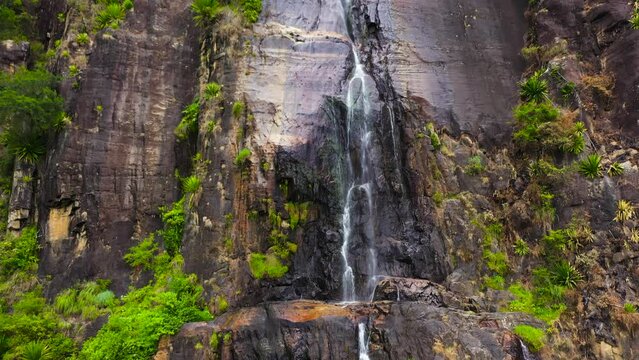 Aerial drone of Bambarakanda Falls in a mountain gorge. Waterfall in the tropical forest. Sri Lanka.