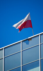 Polish flag on the modern building.