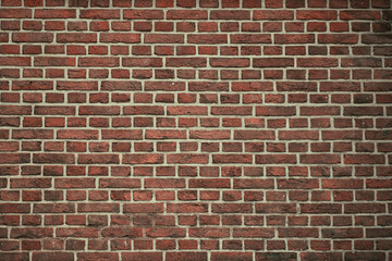 Obraz premium Brick wall background. Pattern brown color design decorative uneven cracked real stone wall surface with cement. Dry brick wall as seamless background