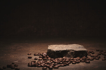 Roasted coffee beans on stone pedestal brown background