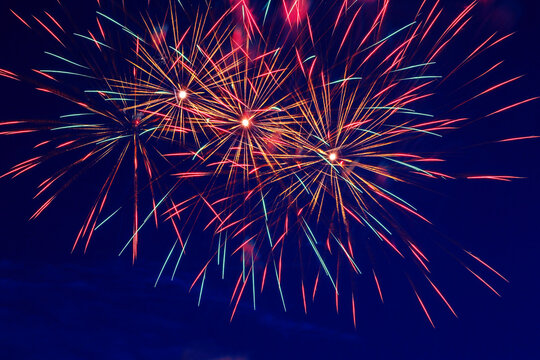 Colorful fireworks in the night sky. Festive pyrotechnic show. Background image.