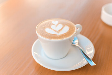 Cup of cappucino on the cafe table with cafe latte art - 523052975