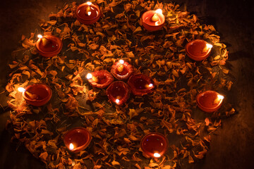 Decorated Diwali lights with colorful diya oil lamp and decorative flowers during diwali festival