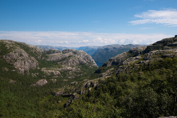 Fototapeta premium The rough rocky mountain landscape on the way to Pulpit Rock (Preikestolen), Stavanger, Norway