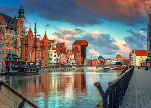 Old town in Gdansk with historical port crane over Motlawa river at sunrise, Poland.