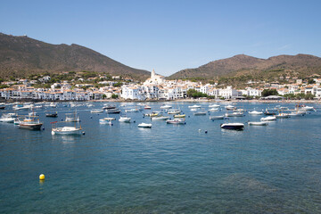 Fototapeta na wymiar Sea coast of Spain, the city of Cadaqués. Panoramic view of mountains and sea with yachts. Travel postcard