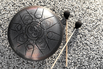 A musical instrument is a glucophone with sticks. Selective focus on glucophone.