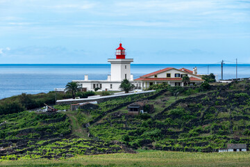 Fototapeta na wymiar Farol das Contendas, lighthouse on the coast on Terceira island, Azores 