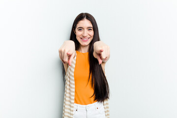 Young caucasian woman isolated on white background cheerful smiles pointing to front.