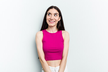 Young caucasian woman isolated on white background relaxed and happy laughing, neck stretched showing teeth.