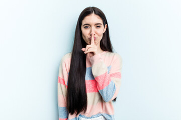 Young caucasian woman isolated on blue background thinking and looking up, being reflective, contemplating, having a fantasy.