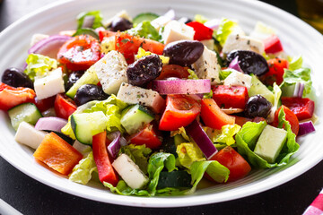 Greek salad. Vegetable salad with tomato, cucumber, feta cheese and olives.