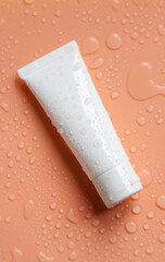 Obraz premium Moisturizing cosmetics on a wet background. Selective focus.