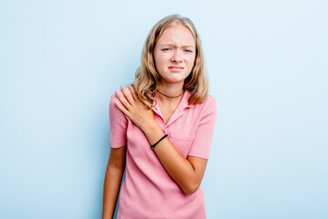 Caucasian teen girl isolated on blue background having a shoulder pain.