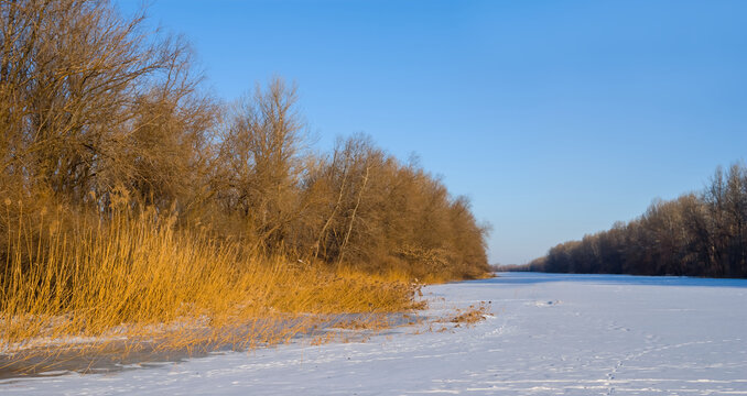 frozen river covered by snow, winter outdoor scene