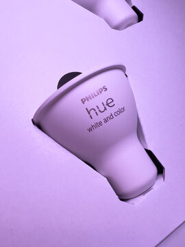 Paris, France - Dec 14, 2021: Close-up macro shot of new Philips Hue GU10 bulb with white and color capabilities - smart illumination controlled by smartphones, computers and voice assistants