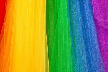 Fabric texture wavy colorful Rainbow LGBT pride flag background.