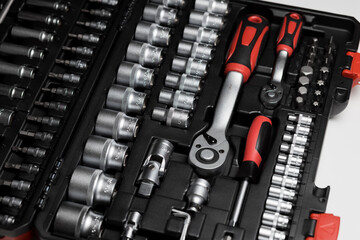 A large set of tools in a black box close-up. Nozzles of different sizes