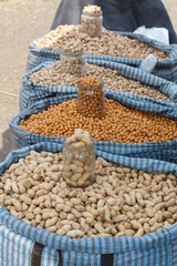 Several types of nuts in bags are sold at the market