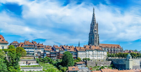 BERN, SWITZERLAND - August 2nd 2022: Panoramic view of Bern and Berner Munster cathedral in a beautiful summer day, Switzerland