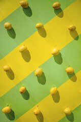 Pop art green and yellow striped background with lemon pattern