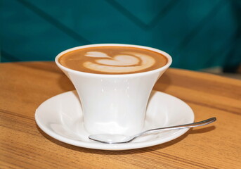 White cappuccino cup with a beautiful foam