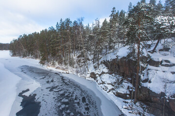 Repovesi National Park, aerial winter view, landscape view of a finnish park, southern Finland, Kouvola and Mantyharju, region of Kymenlaakso, with a group of tourists and wooden infrastructure