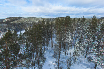 Repovesi National Park, aerial winter view, landscape view of a finnish park, southern Finland, Kouvola and Mantyharju, region of Kymenlaakso, with a group of tourists and wooden infrastructure
