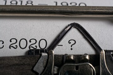 Pandemic 2020 concept  with dates ‘1918-1920’ & ‘2020-?’ typed  on mechanical typewriter