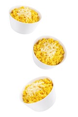 Millet porridge with pumpkin puree and cheese in a bowl on a white isolated background
