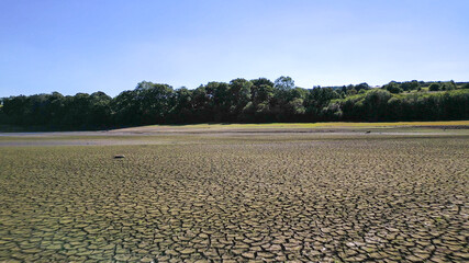 Drone footage of aerial view over Lindley Wood Reservoir, North Yorkshire, during drought in summer...