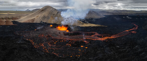 A week old Volcano in Meradalir,  Fagradalsfjall volcano in Iceland 2022. August 9th. Fissure in Geldingadalir. Amazing volcanic eruption on reykjaness. Panorama aerial drone shot © Grzegorz