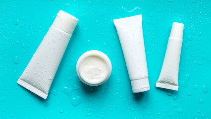 Moisturizing cream on a blue background. Selective focus.