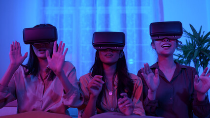 Holiday concept of 4k Resolution. Asian women use vr together in the living room. virtual reality technology.