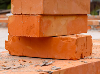 orange ceramic brick for interior walls at a construction site close-up