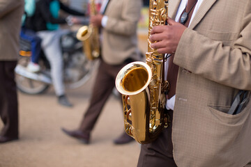 Obraz premium musician's hands playing at a traditional patron saint festival in peru. Concept of traditions and celebrations in South America.