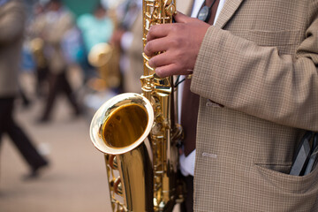Obraz premium musician's hands playing at a traditional patron saint festival in peru. Concept of traditions and celebrations in South America.