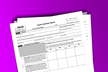Fototapeta na wymiar Form 720-CS documentation published IRS USA 07.17.2012. American tax document on colored